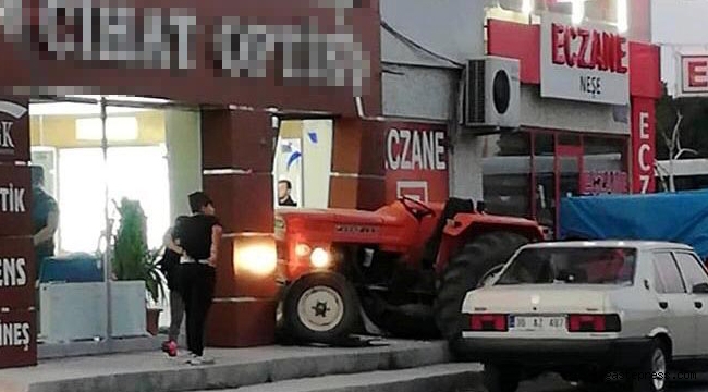 Genç kız, babasının traktörüyle iş yerine girdi!